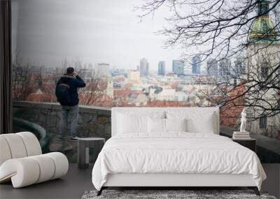 Guy looking at the center of the old town of Bratislava Wall mural