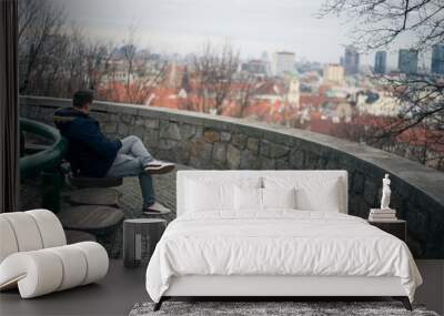 Guy looking at the center of the old town of Bratislava Wall mural