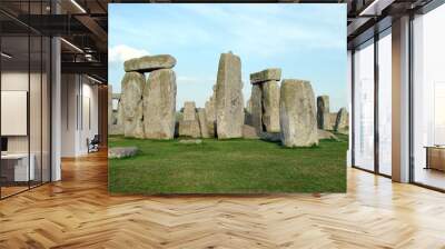 Stonehenge in Hampshire on the background of a cloudy blue sky on a warm summer day at sunset. Wall mural