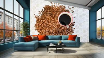 A cup of coffee and coffee beans Wall mural