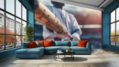 Baseball player in gloves catching a ball at the stadium. Soft focus. Wall mural