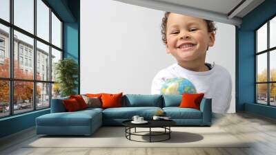 boy holding globe on earth day stock photo Wall mural