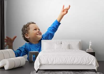 boy reaching for to the sky stock image on white background stock photo Wall mural