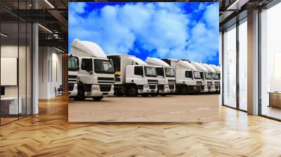 lorries parked up outside a company's car parking area ready to deliver goods to customers stock photo Wall mural