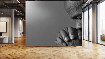 man praying to god on grey black background with people stock photos stock photo Wall mural