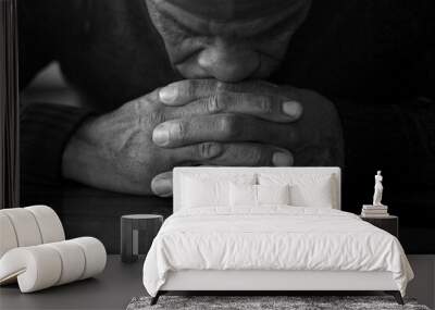 man praying to god with hands together Caribbean man praying stock photo	 Wall mural