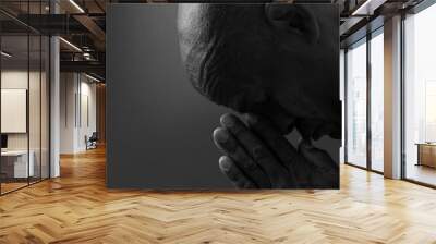 man praying to god with hands together Caribbean man praying with black grey background with people stock image stock photo	 Wall mural