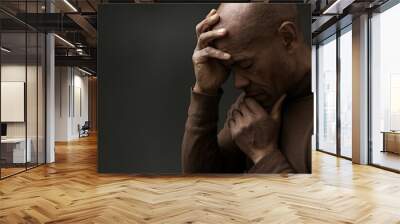 man praying to god with hands together with depression on grey background stock photo	 Wall mural