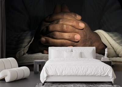 man praying with bible with black background with people stock image stock photo Wall mural