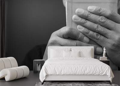 praying to God with hand on bible with background with people stock photo Wall mural