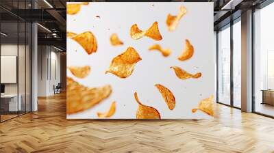 Potato chips in mid air on white background Wall mural