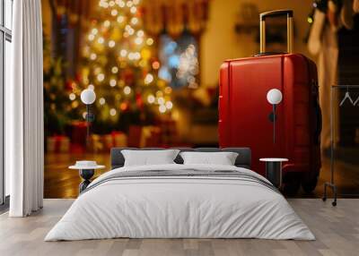 A red suitcase stands on the parquet floor against Christmas tree Wall mural