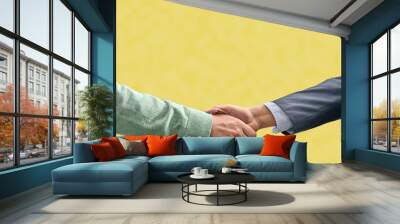 handshake on yellow background verbal agreement concept Wall mural