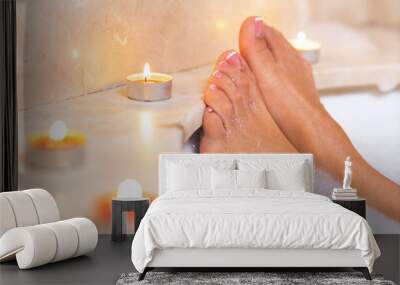 Woman's feet in bath foam . Relaxation in hotel or spa. Wall mural