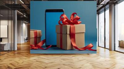 New smartphone with two gift boxes wrapped in red ribbon Wall mural