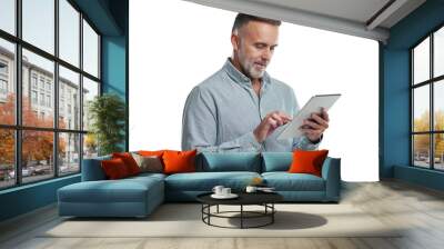 PNG studio shot of a mature man using a digital tablet against a grey background Wall mural