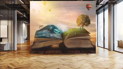 Concept of an open magic book; open pages with water and land and small child. Fantasy, nature or learning concept, with copy space Wall mural