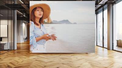 Pretty woman travel  on the beach,Young asian woman relaxing on the beach at Thailand, happy healthy summer vacation Wall mural