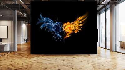 Burning heart. Heart in fire and water isolated on black background Wall mural