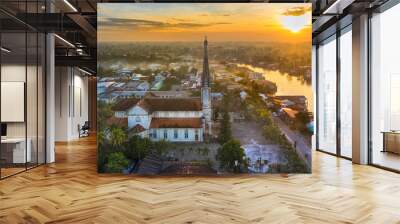 Aerial view of the famous Cai Be church in the Mekong Delta, Roman architectural style. In front is Cai Be floating market, Tien Giang, Vietnam Wall mural