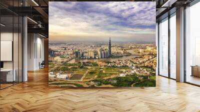 Top view aerial of center Ho Chi Minh City with development buildings, transportation, energy power infrastructure. Financial and business centers in developed Vietnam. View from District 2 Wall mural