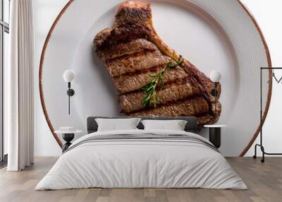 Steak on white plate on transparent background top view Wall mural