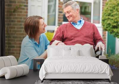 Carer With Senior Man In Wheelchair Wall mural