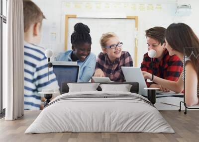 Group Of Teenage Students Collaborating On Project In IT Class Wall mural