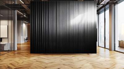 A black and white gradient shines through a textured, see-through glass surface. The light creates a rippling effect on the dark background, making the glass look like a corrugated wall. Wall mural