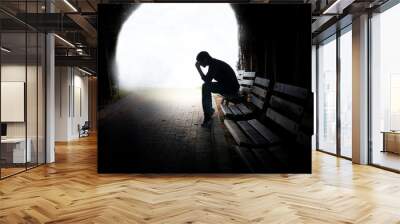 dramatic concept, Silhouette of Sad Depressed man sitting Wall mural