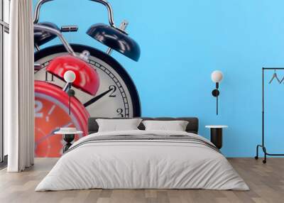 Alarm clock on blue background. Selective focus. Wall mural