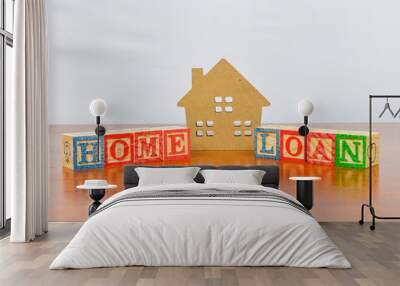 Alphabet wooden block in Home Loan and house toy. Concept of realestate housing sale. Business object on wooden desk. Selective focus. Wall mural