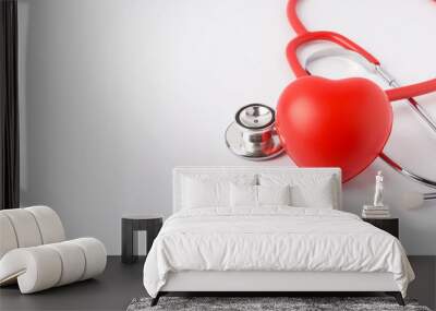 Stethoscope with red heart on white background. Wall mural