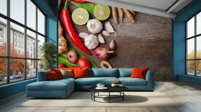 Spices and herbs over wooden background, healthy or cooking conc Wall mural