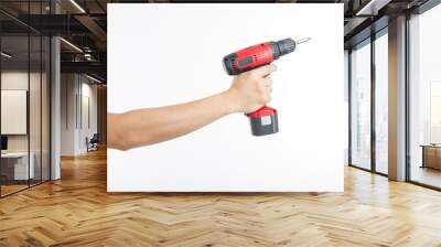 Cordless screwdriver holding by hand Wall mural