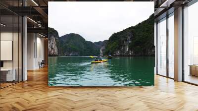 Tourists kayaking in emerald Lan Ha bay, Ha Long, Vietnam Wall mural