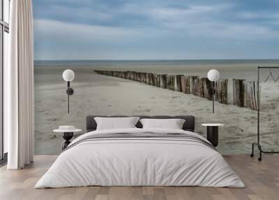 Wooden breakwater along the Dutch coast of Ameland Wall mural