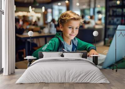 Elementary school boy doing homework in a cafe Wall mural