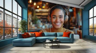 Happy Student Learning Online with Headphones and Laptop in Cafe Wall mural