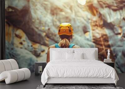 Mountain Climbing Adventure: Young Woman with Climbing Equipment Ready to Conquer the Rock in the Outdoors Wall mural