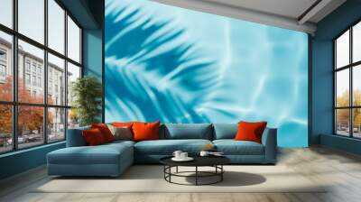 aqua waves and coconut palm shadow on blue background. water pool texture top view.tropical summer m Wall mural