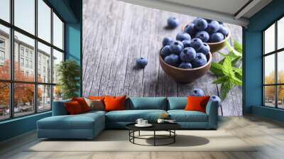 Blueberries in wooden bowl Wall mural