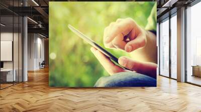 Man holding tablet Wall mural