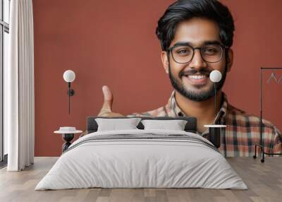 Indian handsome man showing Ok sign with thumbs up for approval, Generative AI Wall mural