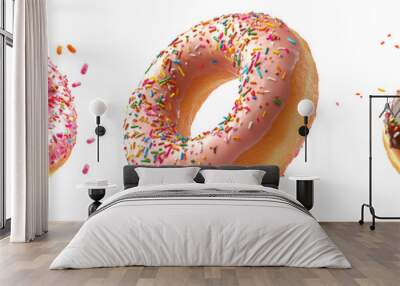 Floating assorted donuts with sprinkles isolated on transparent background Wall mural