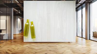 two empty bottles on white wooden background Wall mural