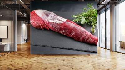 Dry aged beef fillet steak natural as closeup on black background with copy space Wall mural