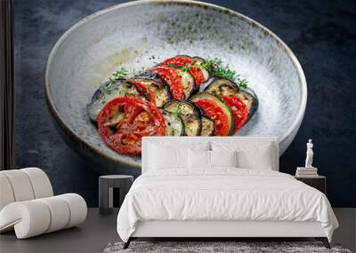 Modern style traditional French ratatouille with tomatoes, eggplant and zucchini served as close-up in a Nordic design bowl Wall mural