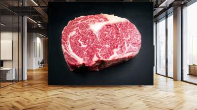 Raw dry aged wagyu entrecote beef steak as closeup on a black background with copy space Wall mural