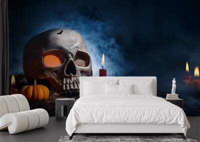 A creepy laughing pumpkin and an old skull set on a gothic fireplace, perfect for a Halloween atmosphere filled with witchcraft and magic. Wall mural